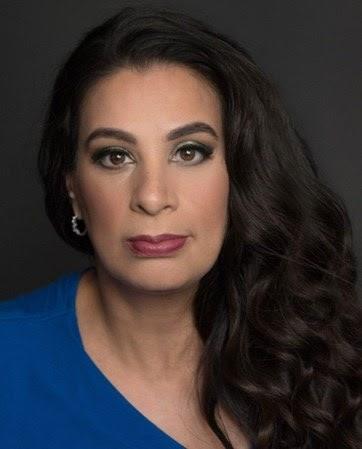 Headshot photo of Maysoon Zayid