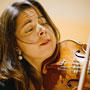 Close up image of violinist Simin Ganatra playing her instrument
